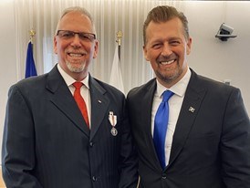 Photo of Cam Stewart, consultant for the Alberta Human Rights Commission standing with Alberta Minister Mike Ellis.